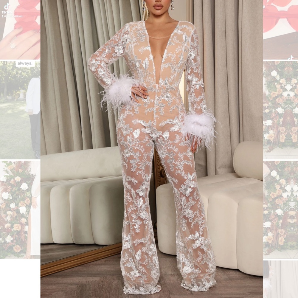 - Nude and white lace jumpsuit with fur cuff sleeves